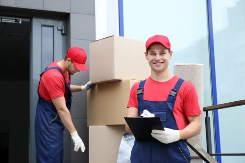 Professional movers handling commercial assets in Hampstead storage facility