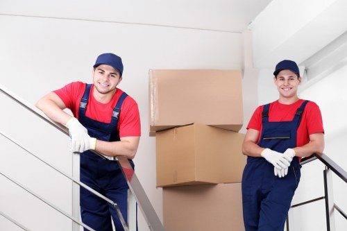 Professional packers organizing items in Hampstead storage facility
